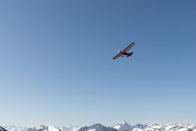 Low angle view of air plane against clear sky