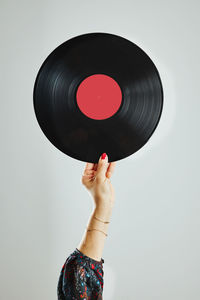 Woman holding vinyl record. music passion. listening to music from analog record. retro music party
