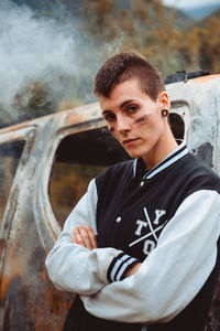 Portrait of young man standing outdoors