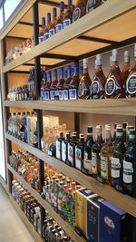 Bottles on display at market stall