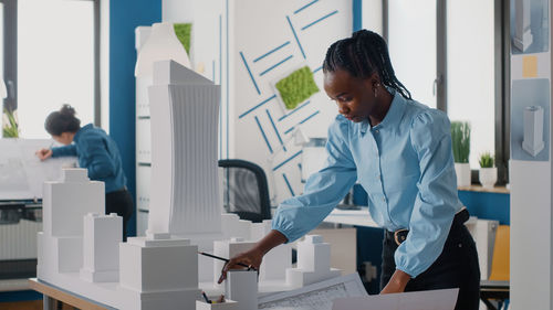 Side view of doctor working in office