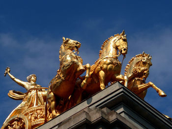 Low angle view of statue against sky