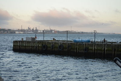 Scenic view of sea against cloudy sky