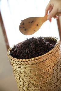 Close-up of hand holding ice cream basket