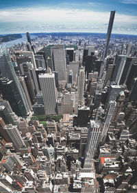 High angle view of modern buildings in city against sky