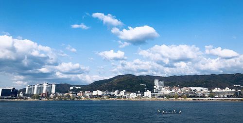 Scenic view of sea and buildings against sky