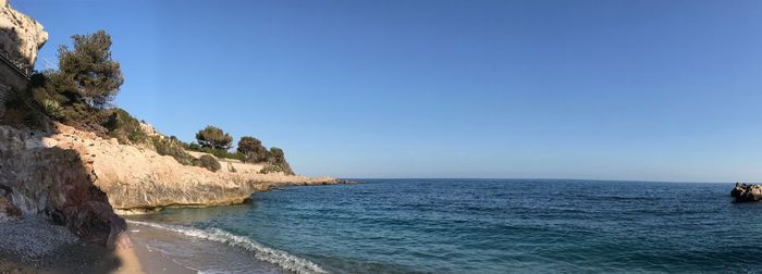 Scenic view of sea against clear blue sky