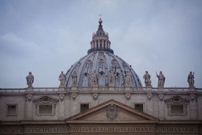 Low angle view of historical building against cloudy sky