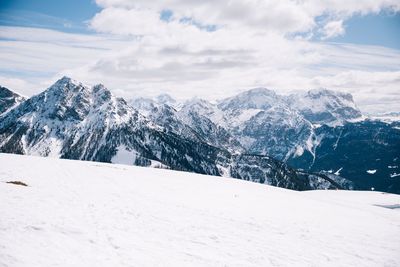 Scenic view of snow covered mountains against sky