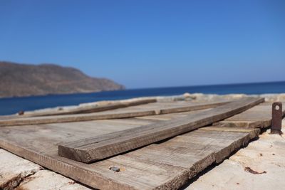 Scenic view of beach against clear blue sky