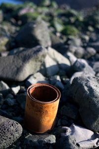 High angle view of tea cup on rock