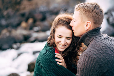 Portrait of smiling young woman in winter