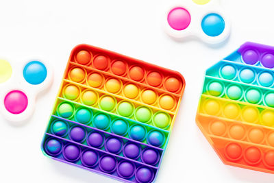 High angle view of multi colored pencils on white background