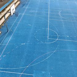 High angle view of basketball hoop against blue sky