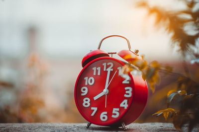 Close-up of clock on table