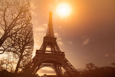 Low angle view of eiffel tower against sky during sunset