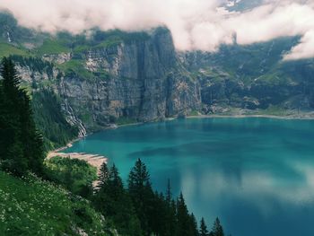 Scenic view of lake and trees against sky