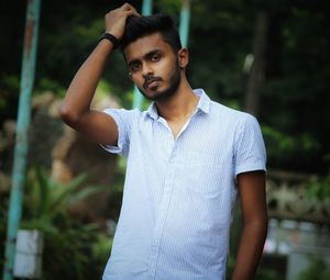 Portrait of young man standing outdoors