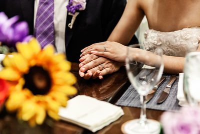 Midsection of woman holding flower bouquet