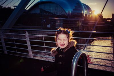 Smiling girl on bridge