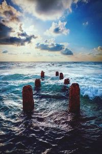 Scenic view of sea against cloudy sky