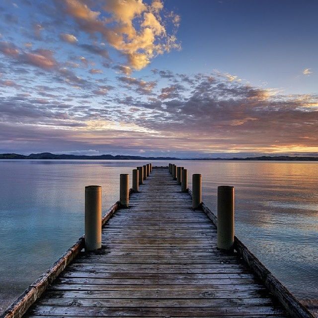 the way forward, water, pier, sky, sea, tranquil scene, tranquility, scenics, diminishing perspective, jetty, boardwalk, wood - material, beauty in nature, sunset, long, nature, cloud - sky, horizon over water, railing, vanishing point