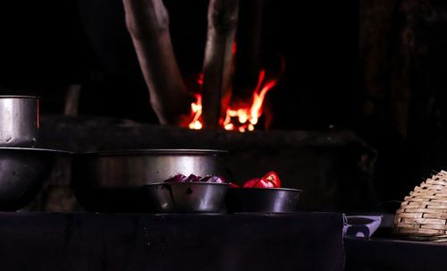Midsection of man preparing food on barbecue grill