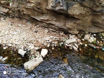 High angle view of garbage on rock