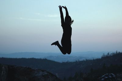 Woman jumping in mid-air