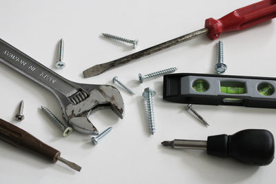 High angle view of work tools on white background