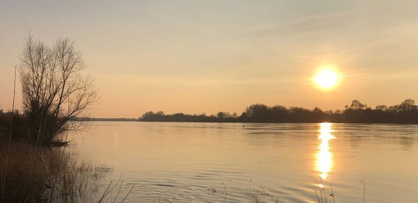 Scenic view of lake during sunset