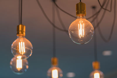 Low angle view of illuminated light bulb