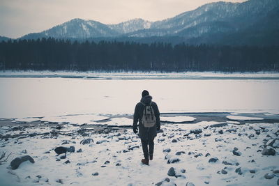 Rear view of a man in snow