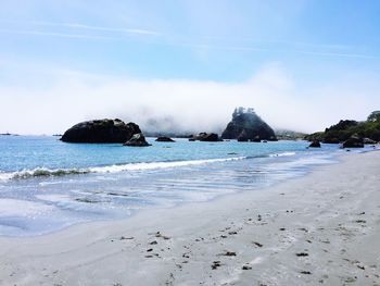 View of calm beach against the sky