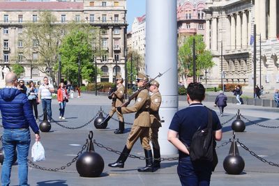 People standing on street in city