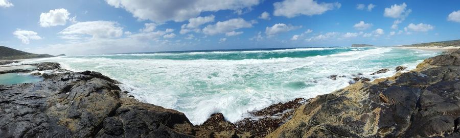 Panoramic view of sea against cloudy sky