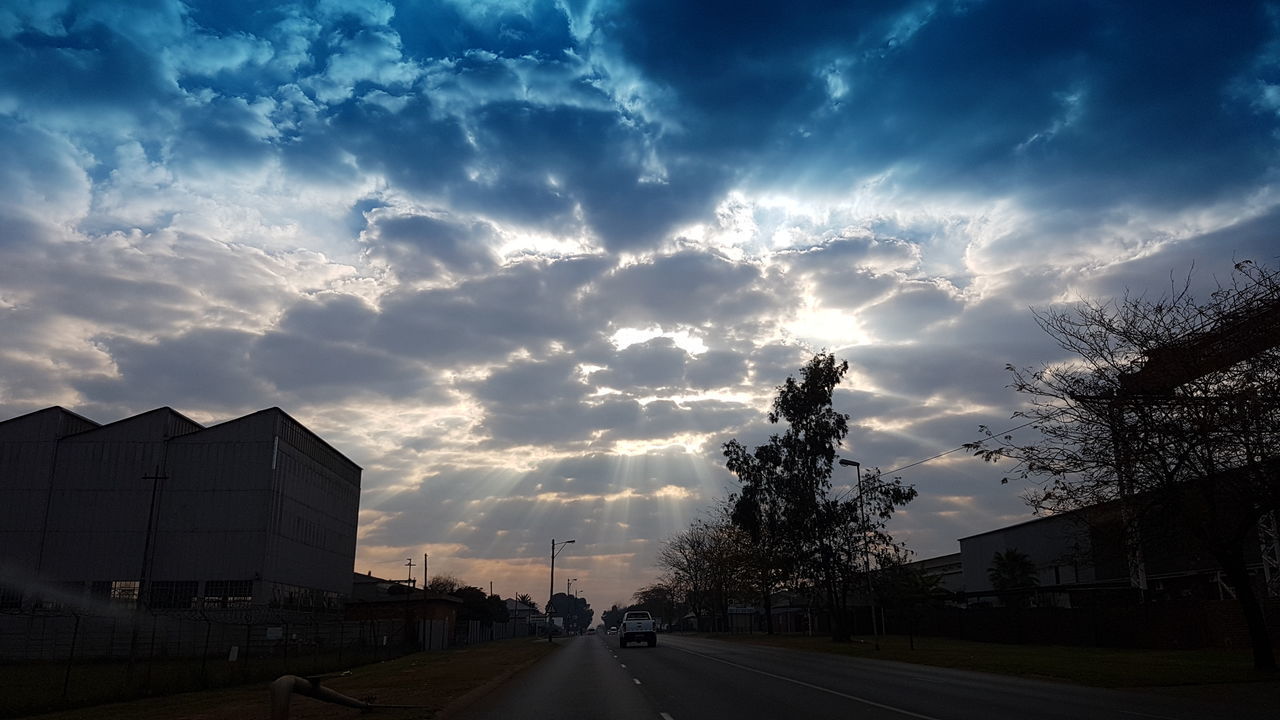 ROAD IN CITY AGAINST SKY