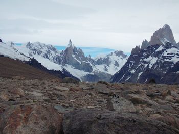 Scenic view of snowcapped mountains against sky