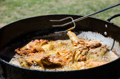 Close-up of meat in cooking pan