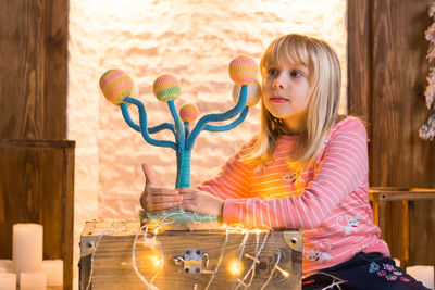 Portrait of cute girl in table