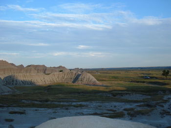 Scenic view of landscape against blue sky