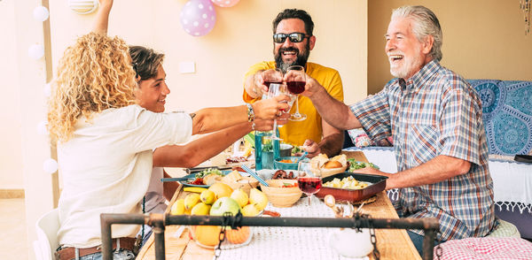 Group of people drinking glass on table