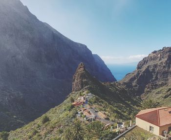 High angle view of building and mountains against sky