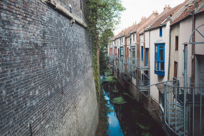 High angle view of canal by buildings in city