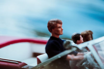 Close-up of toy boat with figurines