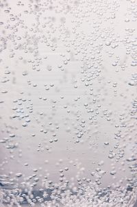 Full frame shot of wet glass window