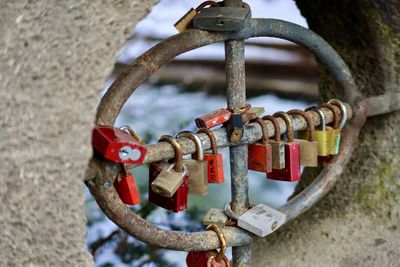 Close-up of padlocks on railing