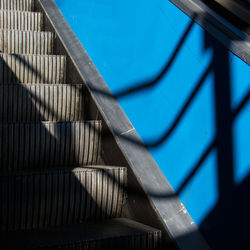 Close-up of steps against blue wall