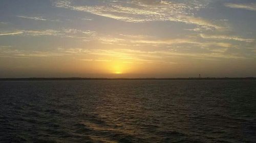 Scenic view of sea at sunset