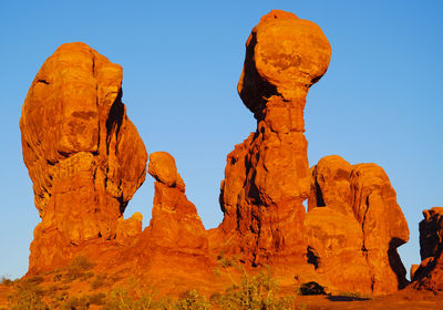 Low angle view of rock formation against sky